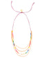 Venessa Arizaga SS26 Rainbow Aura Necklace — adjustable blue/coral threadwork with rainbow glass and mother-of-pearl charms spelling I LOVE ME on multi-row gold chains; colorful aura radiating self-love and joy. Can be worn long or as a choker.
