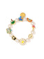Venessa Arizaga SS26 Dreamy Days Pearl Bracelet — elastic crystal pearl band accented with gold-plated enamel charms (palm trees, suitcases, cameras) and pave rhinestones; soft white stackable whimsy in mixed-media resort palette.